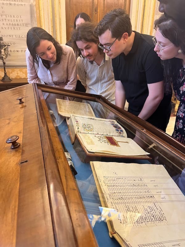 Sofia, Andrei, Matteo, and Hunter examining Henry VIII's love letters to Anne Boleyn